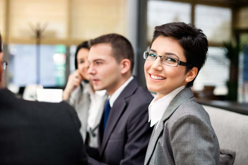 people sitting at a conference table