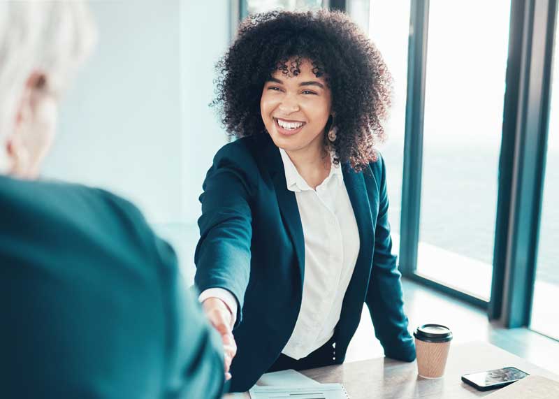 Woman shaking hands with an interviewer