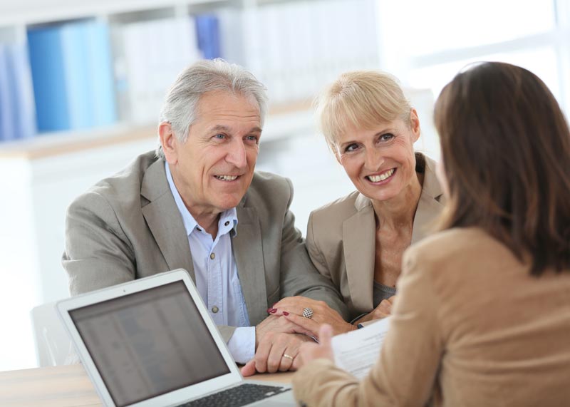 Older couple talking with a sales representative