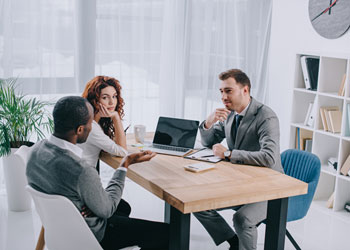 Three people meeting in an office